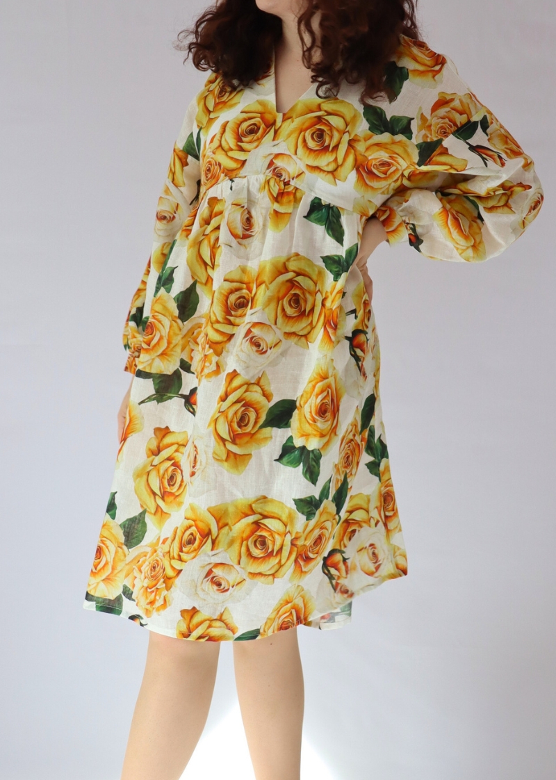 Close-up of the amazing Italian linen fabric pattern of the golden rose dress
