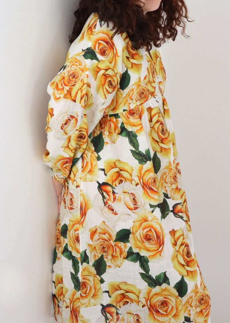 Side view of golden rose linen dress showing the lowered armscye and kimono sleeve design