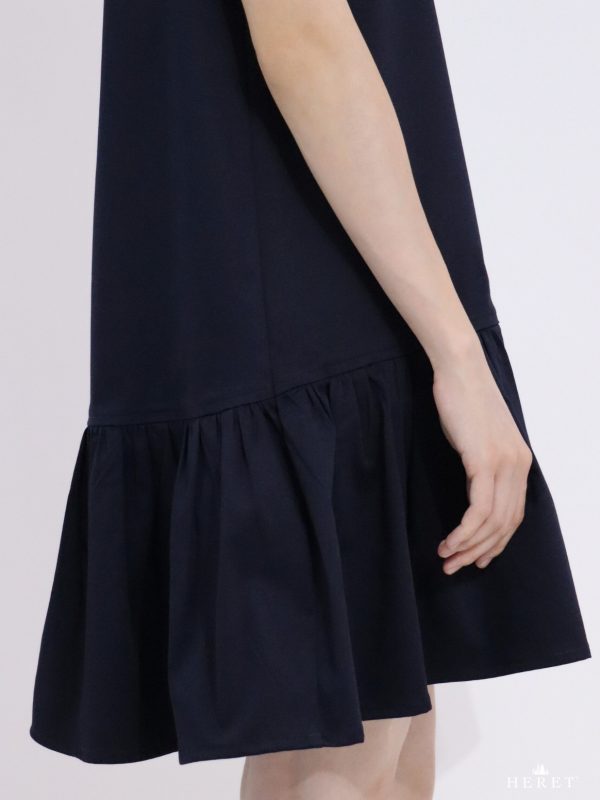 Eclipse Dress – close-up of the lower part with flowy ruffled hem in dark blue fabric