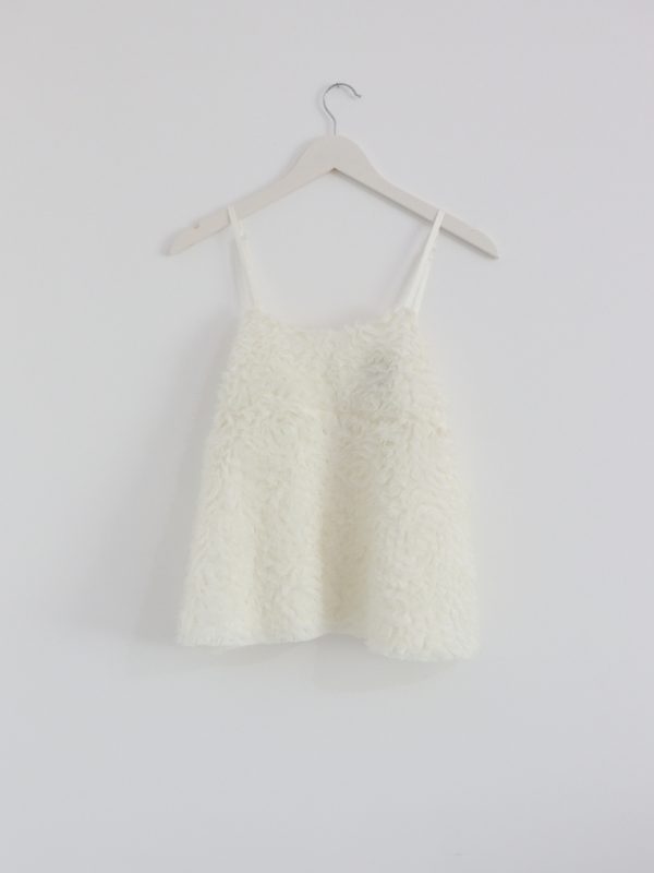 Elegant white tulle top with airy embroidered details, perfect for a feminine look