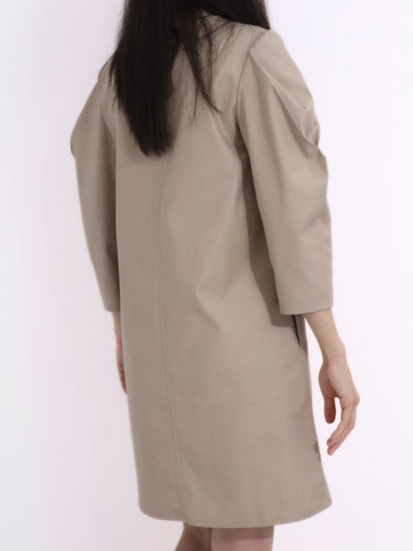 Back view of HERET beige cotton fall dress showing relaxed fi