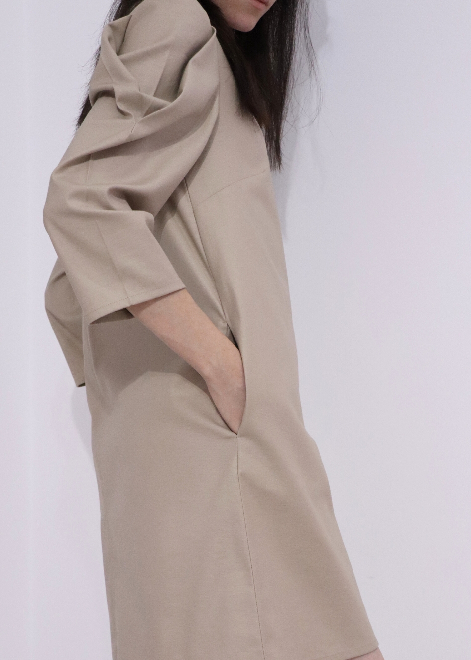 Sleeves of Heret beige cotton fall dress showing relaxed fit